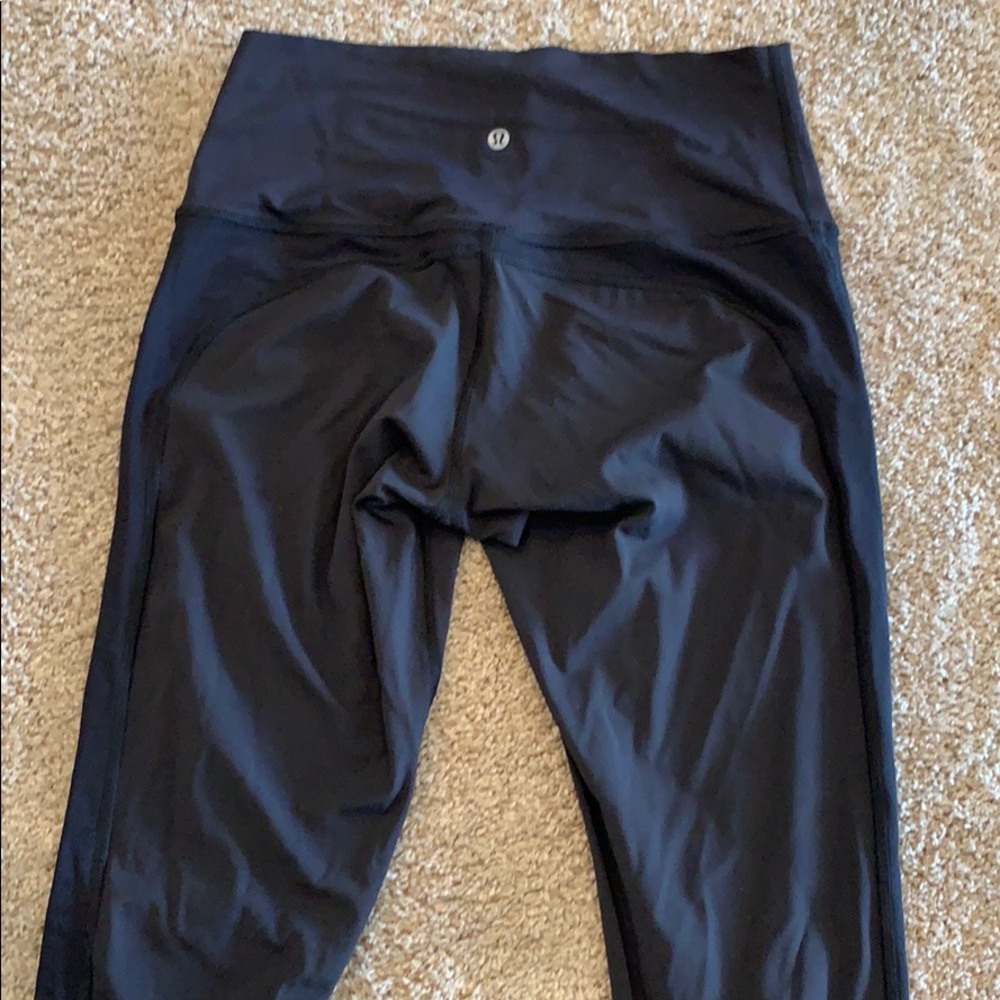 Black Lulu lemon leggings with design on both legs